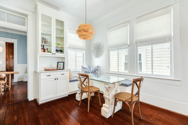 1717 Winnie St, Galveston, TX 77550 - dining area with dark wood finished floors, crown molding, a wainscoted wall, and a chandelier
