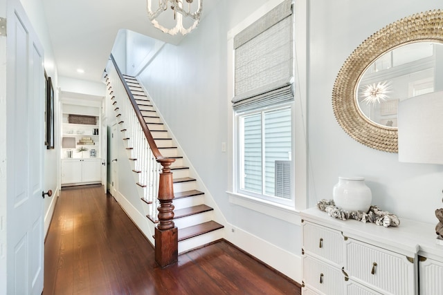 1717 Winnie St, Galveston, TX 77550 - stairway with wood finished floors, a chandelier, recessed lighting, and baseboards
