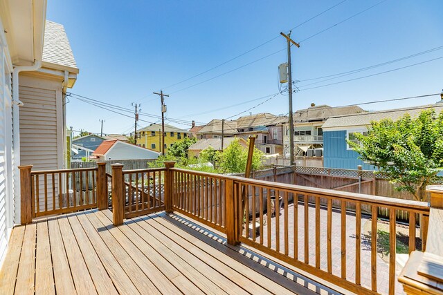 1717 Winnie St, Galveston, TX 77550 - wooden deck with a residential view and a fenced backyard