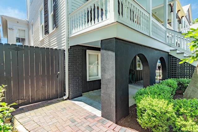 1717 Winnie St, Galveston, TX 77550 - view of exterior entry with fence and brick siding