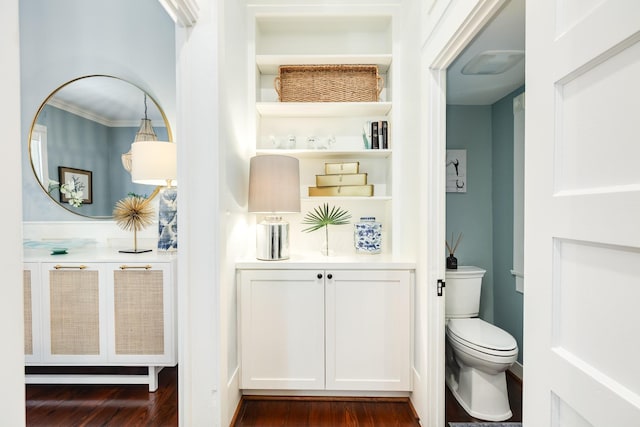 1717 Winnie St, Galveston, TX 77550 - bathroom featuring toilet, wood finished floors, and crown molding