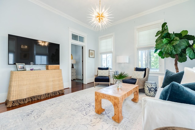 1717 Winnie St, Galveston, TX 77550 - living room featuring wood finished floors, crown molding, a chandelier, and baseboards