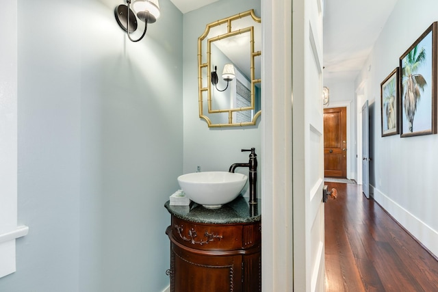 1717 Winnie St, Galveston, TX 77550 - bathroom featuring wood finished floors, vanity, and baseboards