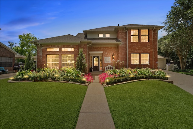 15106 Cranbourne Dr, Houston, TX 77062 - view of front facade featuring brick siding, a front yard, concrete driveway, and roof with shingles