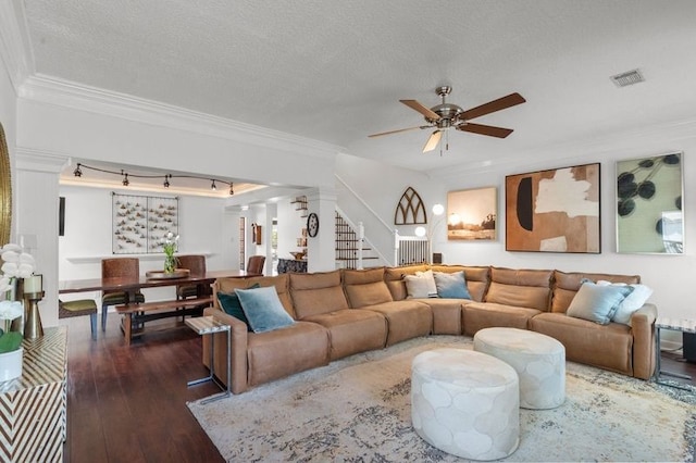 15106 Cranbourne Dr, Houston, TX 77062 - living room featuring stairs, dark wood finished floors, ornamental molding, ceiling fan, and a textured ceiling