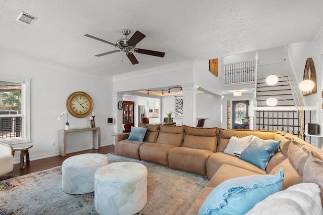 15106 Cranbourne Dr, Houston, TX 77062 - living room featuring ornamental molding, ceiling fan, a textured ceiling, wood finished floors, and baseboards