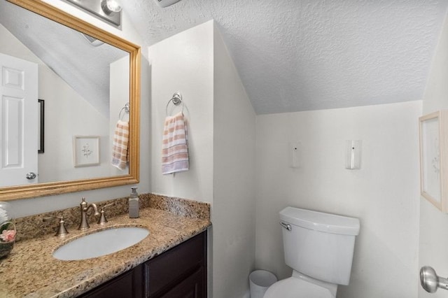 15106 Cranbourne Dr, Houston, TX 77062 - bathroom with vaulted ceiling, a textured ceiling, toilet, and vanity