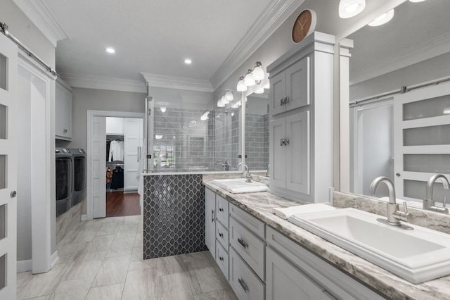 15106 Cranbourne Dr, Houston, TX 77062 - full bathroom with independent washer and dryer, crown molding, double vanity, a tile shower, and recessed lighting