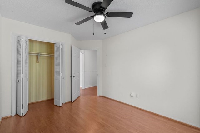 15106 Cranbourne Dr, Houston, TX 77062 - unfurnished bedroom featuring wood finished floors, a closet, baseboards, and a ceiling fan