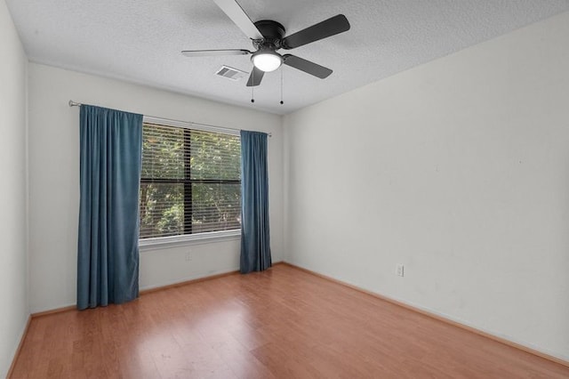 15106 Cranbourne Dr, Houston, TX 77062 - unfurnished room with wood finished floors, ceiling fan, a textured ceiling, and baseboards