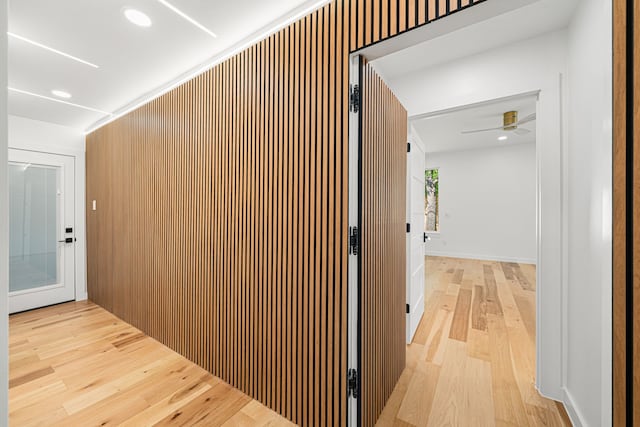 hall with light wood-style flooring and recessed lighting