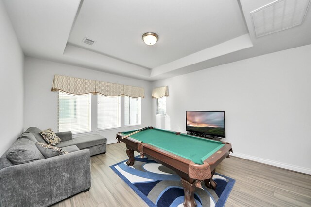1935 Creekwood Cv, Missouri City, TX 77459 - rec room with a raised ceiling, billiards, light wood-style floors, and baseboards