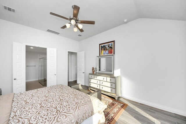 1935 Creekwood Cv, Missouri City, TX 77459 - bedroom with wood finished floors, baseboards, lofted ceiling, and a ceiling fan