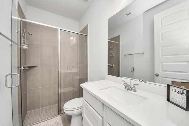 1935 Creekwood Cv, Missouri City, TX 77459 - bathroom with a shower stall, toilet, and vanity