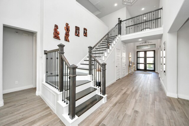 1935 Creekwood Cv, Missouri City, TX 77459 - foyer with wood finished floors, baseboards, a high ceiling, and recessed lighting