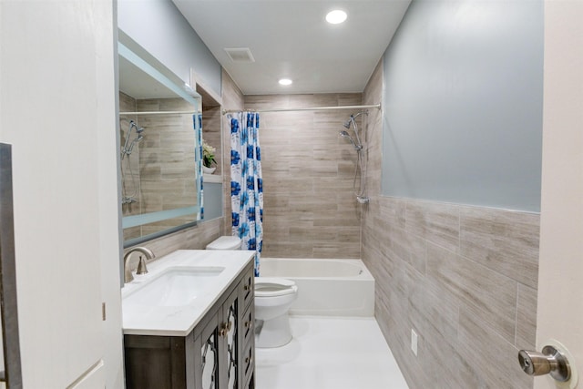 7900 Westheimer Rd Unit 246, Houston, TX 77063 - full bath with tile walls, toilet, shower / bath combo with shower curtain, vanity, and recessed lighting