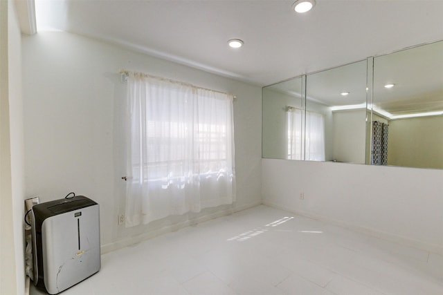 7900 Westheimer Rd Unit 246, Houston, TX 77063 - tiled empty room with recessed lighting