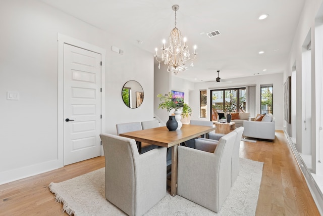 2621 Greenbriar Dr, Houston, TX 77098 - dining area with recessed lighting, a chandelier, light wood finished floors, a ceiling fan, and baseboards
