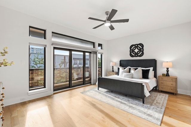 2621 Greenbriar Dr, Houston, TX 77098 - bedroom with access to outside, wood finished floors, a ceiling fan, and baseboards