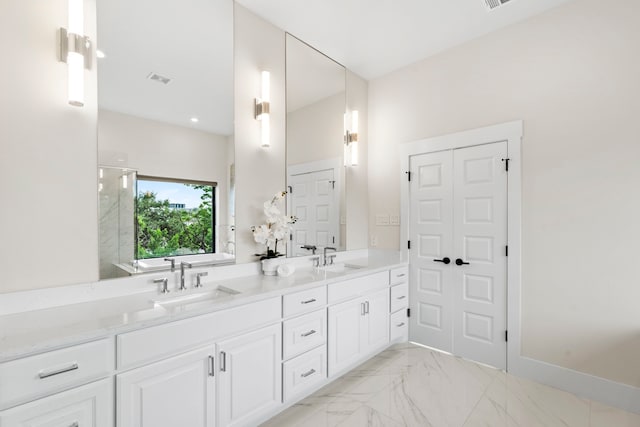 2621 Greenbriar Dr, Houston, TX 77098 - bathroom featuring double vanity, marble look tile flooring, and a shower with door
