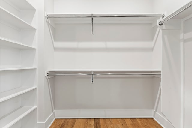 2621 Greenbriar Dr, Houston, TX 77098 - spacious closet featuring wood finished floors