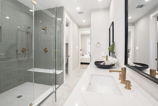 2216 Francis St, Houston, TX 77004 - ensuite bathroom with a shower stall, double vanity, and recessed lighting