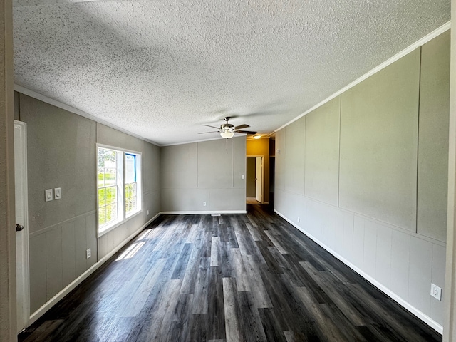 18549 Indigo Way, Porter, TX 77365 - unfurnished room featuring a decorative wall, a textured ceiling, dark wood finished floors, crown molding, and ceiling fan