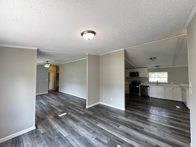 18549 Indigo Way, Porter, TX 77365 - unfurnished living room with a textured ceiling, a sink, ornamental molding, dark wood finished floors, and ceiling fan