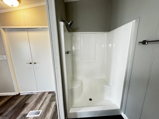 18549 Indigo Way, Porter, TX 77365 - full bath featuring a shower stall and wood finished floors