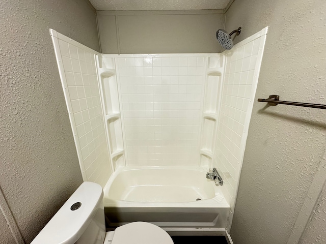18549 Indigo Way, Porter, TX 77365 - bathroom with a textured wall, toilet, and shower / washtub combination