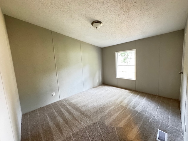 18549 Indigo Way, Porter, TX 77365 - carpeted spare room with a textured ceiling