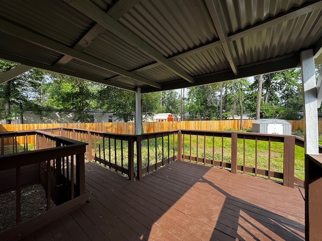 18549 Indigo Way, Porter, TX 77365 - wooden deck with a fenced backyard, a storage shed, and an outbuilding