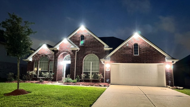 11316 Misty Morning St, Pearland, TX 77584 - view of front of home with brick siding, concrete driveway, a lawn, and a garage