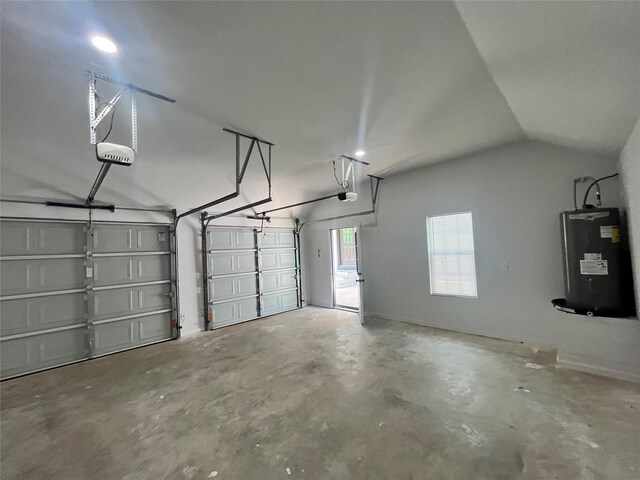 21268 White Oak Dr, Conroe, TX 77306 - garage featuring water heater and a garage door opener