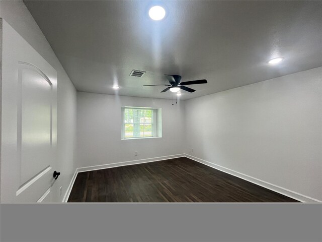 21268 White Oak Dr, Conroe, TX 77306 - unfurnished room with ceiling fan, baseboards, dark wood-type flooring, and recessed lighting