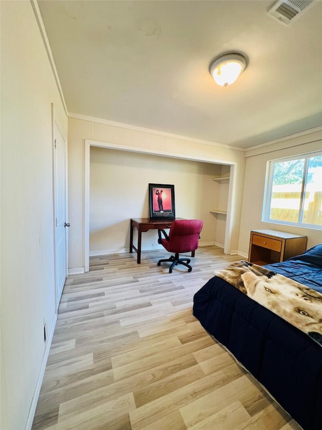 4919 Donald St, Seabrook, TX 77586 - bedroom featuring light wood finished floors, ornamental molding, baseboards, and a closet