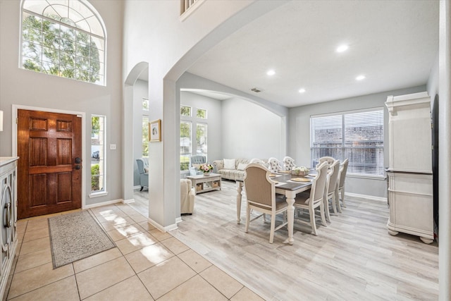 5206 Spring Oak Dr, Pasadena, TX 77505 - entryway with arched walkways, recessed lighting, baseboards, healthy amount of natural light, and light wood finished floors
