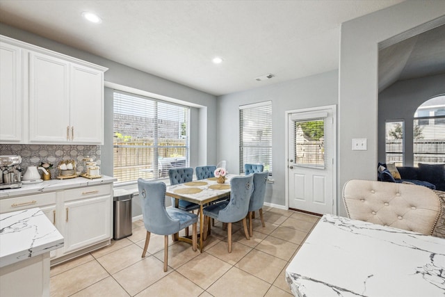 5206 Spring Oak Dr, Pasadena, TX 77505 - dining space with light tile patterned flooring, plenty of natural light, and recessed lighting