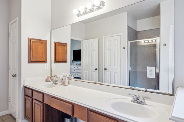 5206 Spring Oak Dr, Pasadena, TX 77505 - bathroom with a shower stall, double vanity, and tile patterned floors
