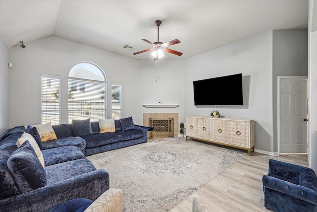 5206 Spring Oak Dr, Pasadena, TX 77505 - living area with ceiling fan, wood finished floors, a fireplace, and vaulted ceiling