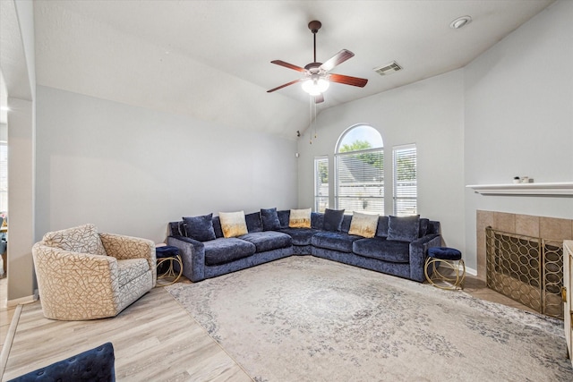 5206 Spring Oak Dr, Pasadena, TX 77505 - living area featuring a ceiling fan, wood finished floors, vaulted ceiling, and a fireplace