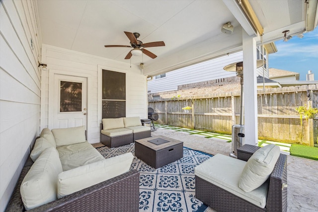 5206 Spring Oak Dr, Pasadena, TX 77505 - view of patio featuring ceiling fan, a fenced backyard, and an outdoor living space