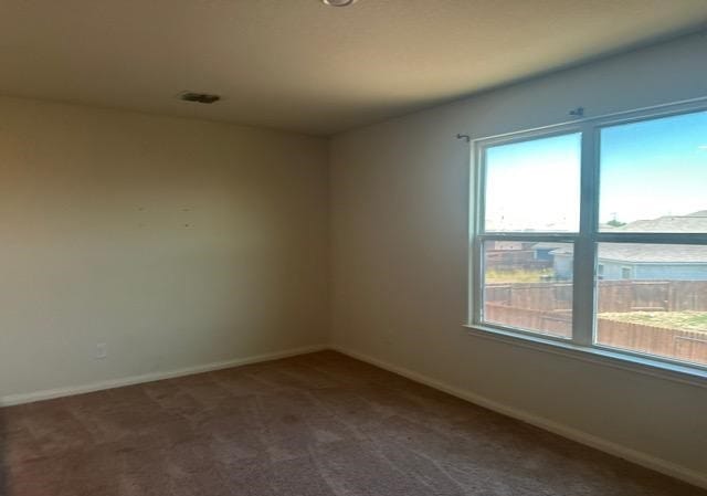11822 Claudette St, San Antonio, TX 78252 - carpeted spare room with baseboards