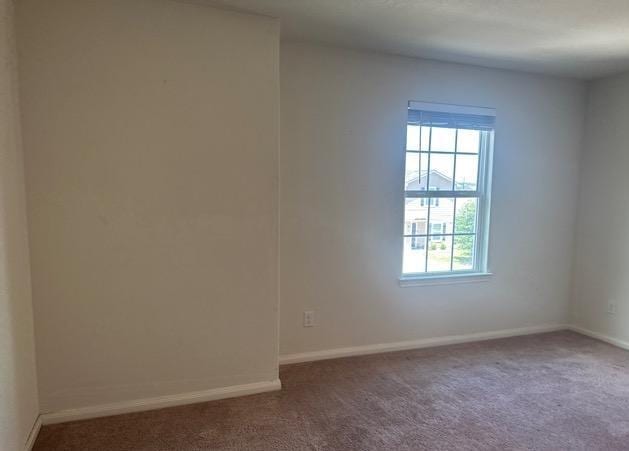 11822 Claudette St, San Antonio, TX 78252 - spare room featuring carpet and baseboards