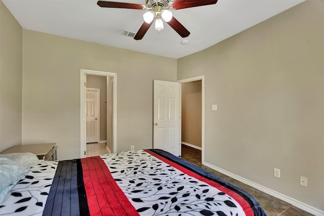 34606 Lake Side Dr, Brookshire, TX 77423 - bedroom featuring baseboards, a ceiling fan, tile patterned flooring, and connected bathroom