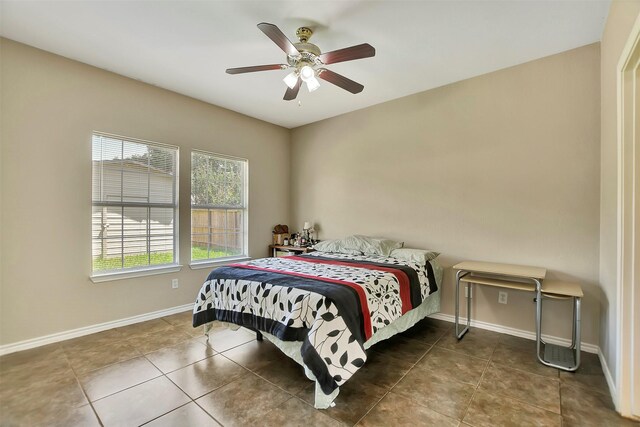 34606 Lake Side Dr, Brookshire, TX 77423 - tiled bedroom featuring baseboards and a ceiling fan