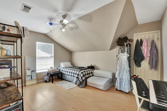 34606 Lake Side Dr, Brookshire, TX 77423 - bedroom with vaulted ceiling, wood finished floors, ceiling fan, and baseboards