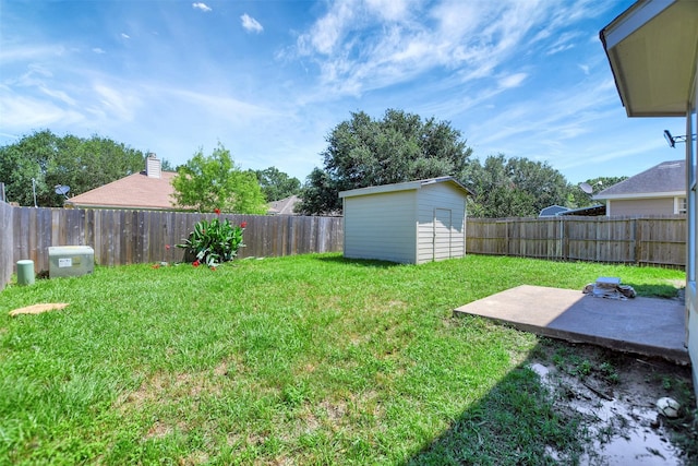 34606 Lake Side Dr, Brookshire, TX 77423 - view of yard with an outbuilding, a patio, and a storage shed