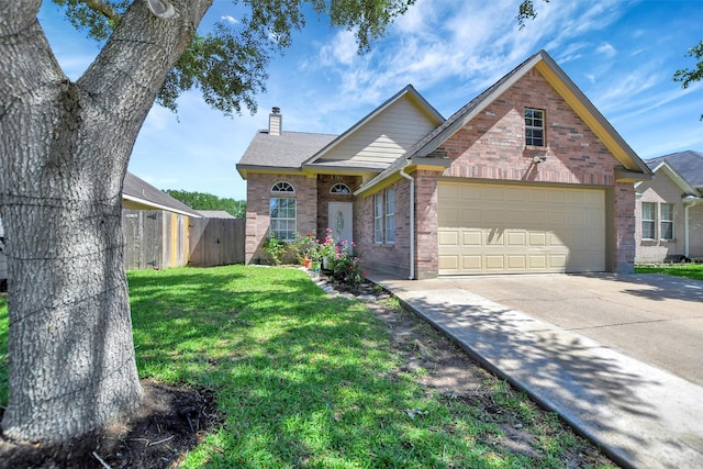 34606 Lake Side Dr, Brookshire, TX 77423 - traditional home featuring brick siding, a chimney, concrete driveway, a garage, and a gate