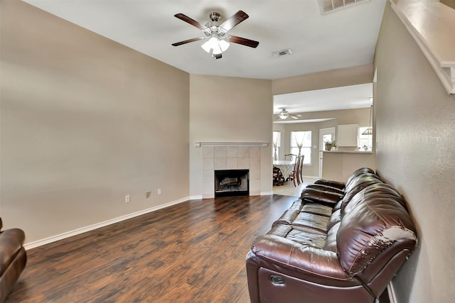 34606 Lake Side Dr, Brookshire, TX 77423 - living area with a ceiling fan, wood finished floors, baseboards, and a tiled fireplace